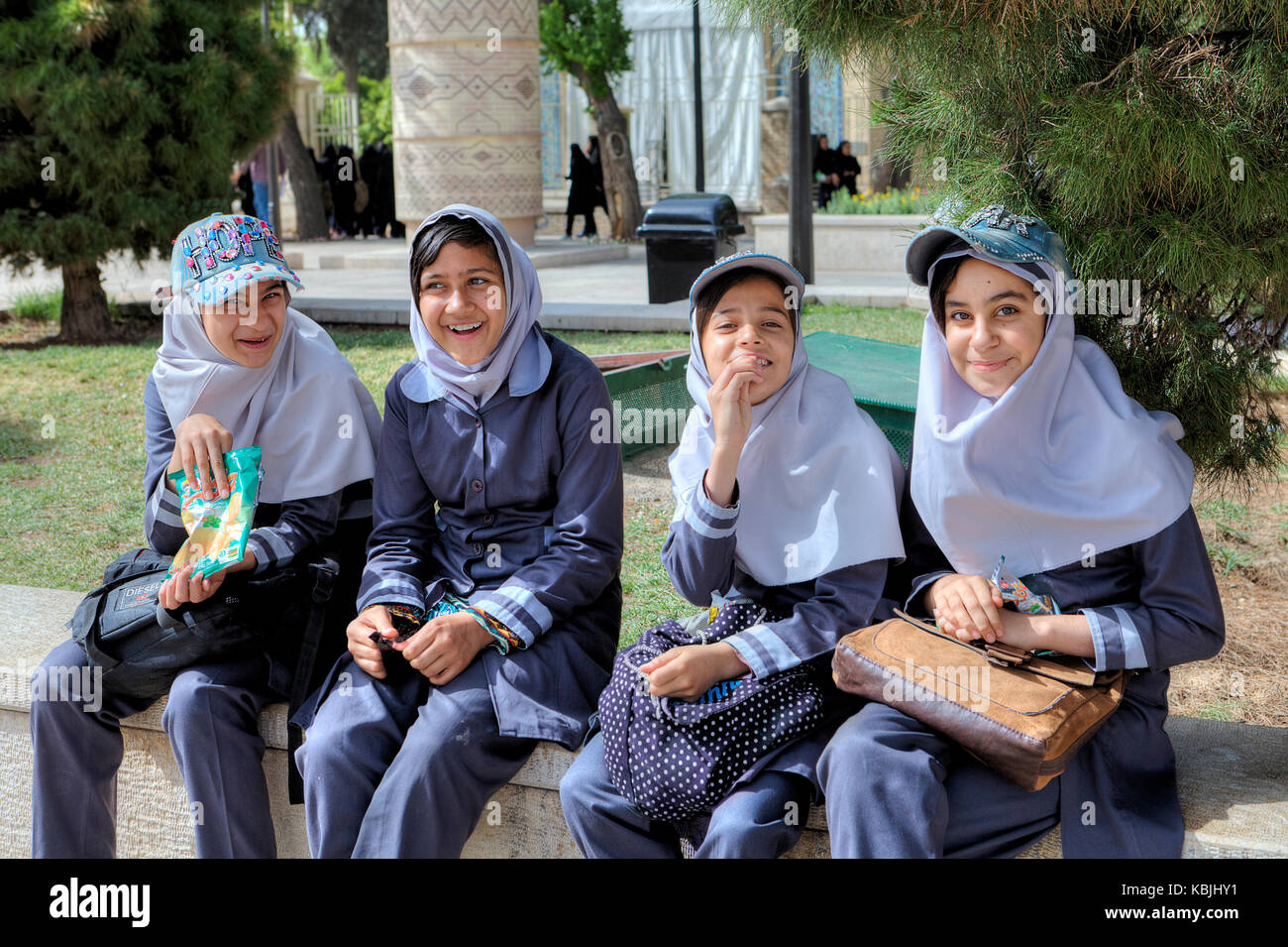 Fars Province, Shiraz, Iran - 19 april, 2017: Iranian school girls in an  Islamic school uniform are resting in the city park Stock Photo - Alamy