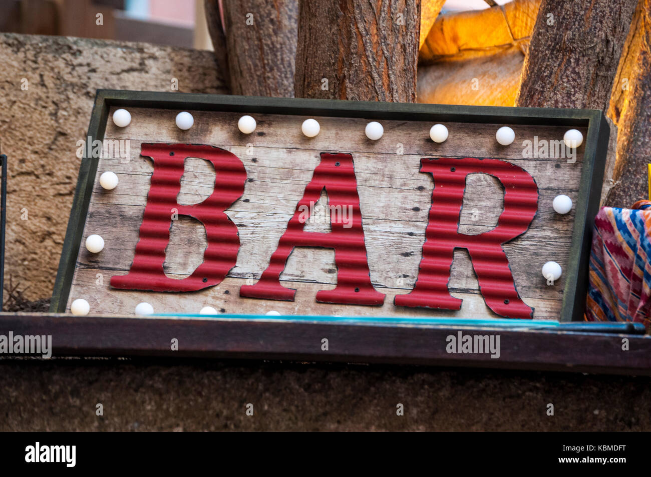 Vintage decorations: a neon sign of a bar with a frame of bulbs Stock Photo