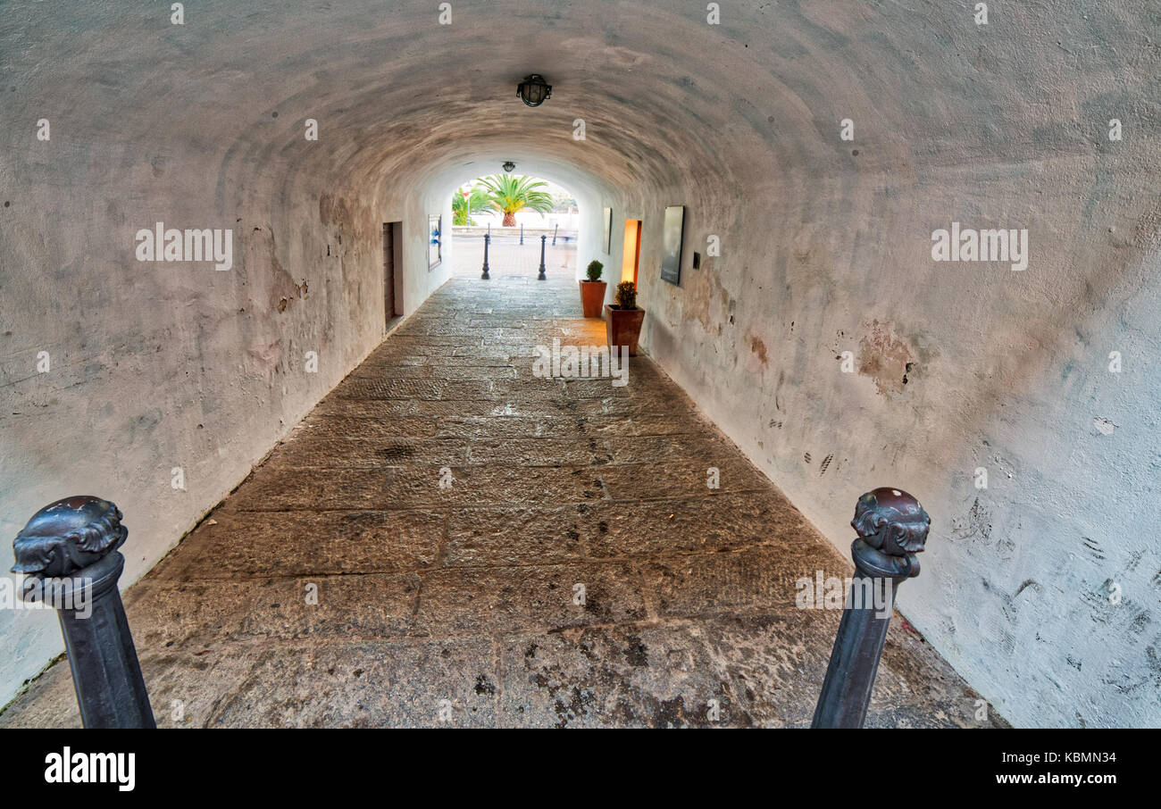 tunnel towards palm trees in a tourist resort in Italy Stock Photo - Alamy