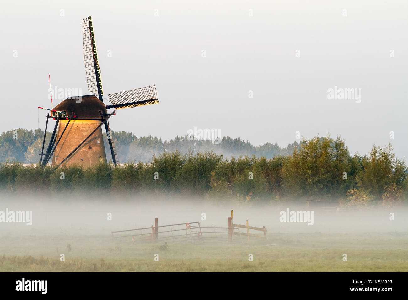 fog near the windmills in Kinderdijk in Holland Stock Photo