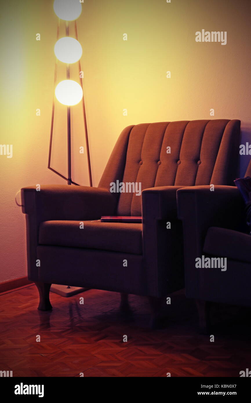 old armchair and vintage lamp in an old living room Stock Photo - Alamy