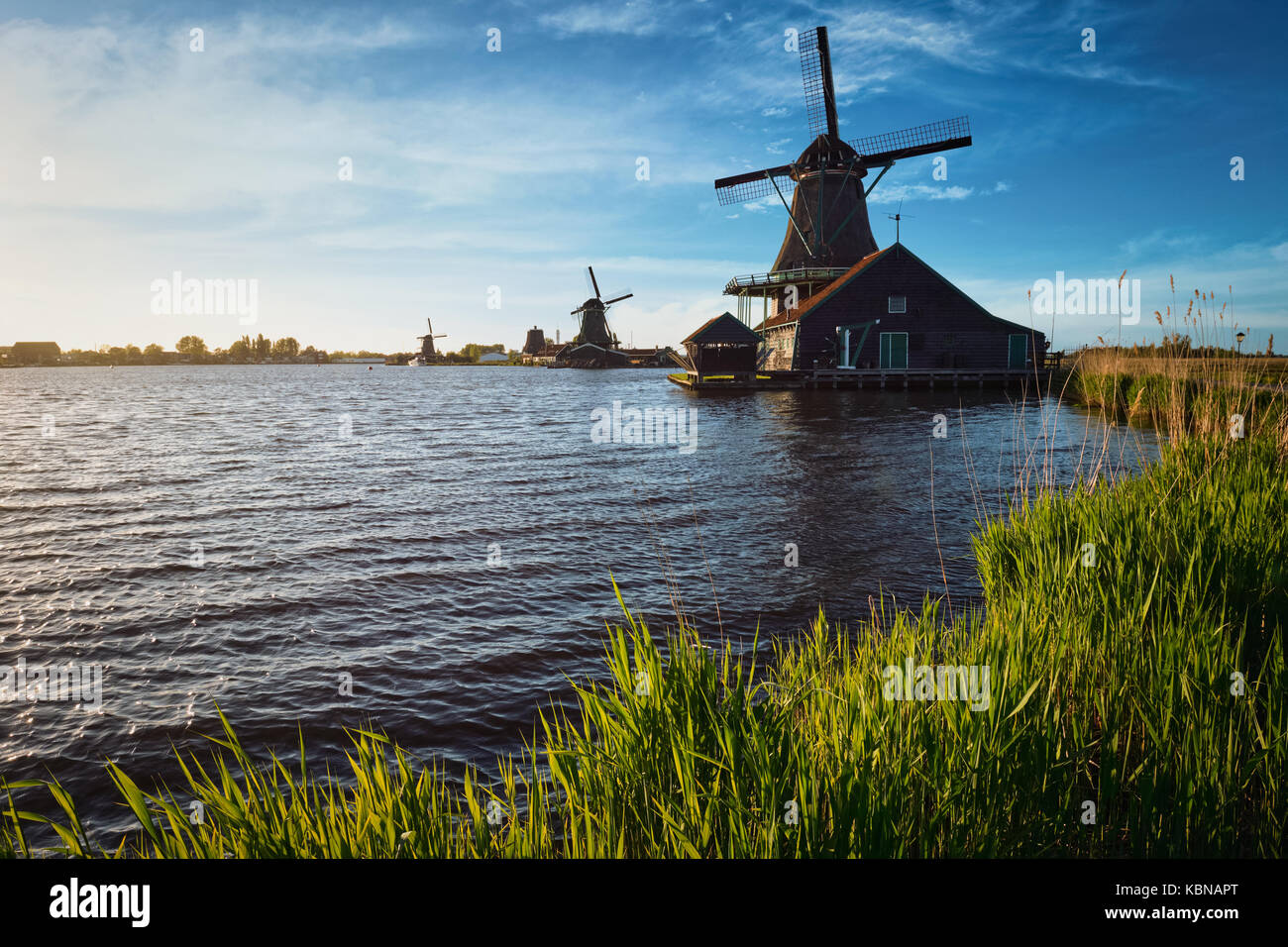 Windmills at Zaanse Schans in Holland on sunset. Zaandam, Nether Stock Photo