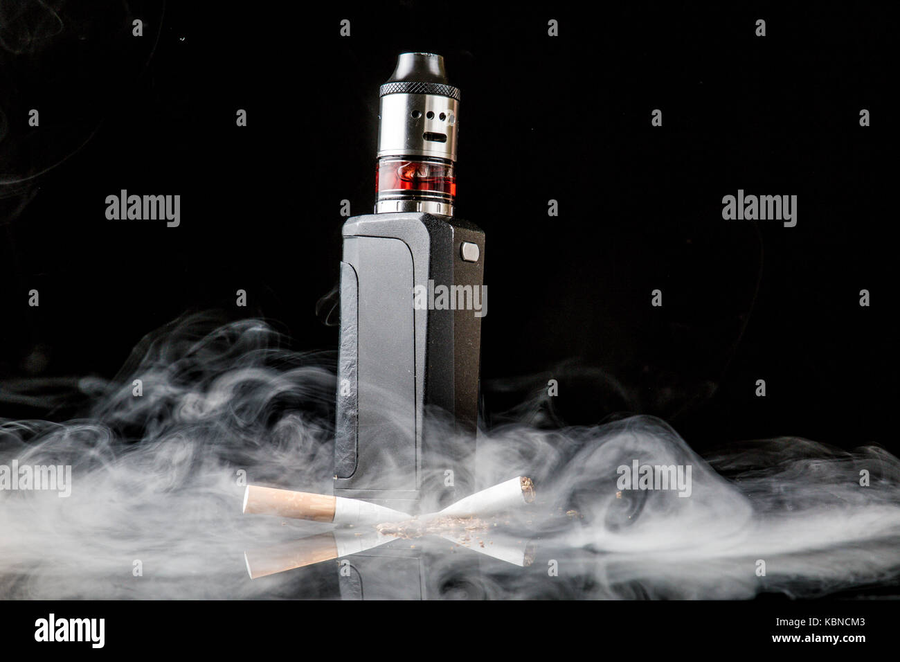 Modern vaporiser versus old tobacco cigarette Stock Photo