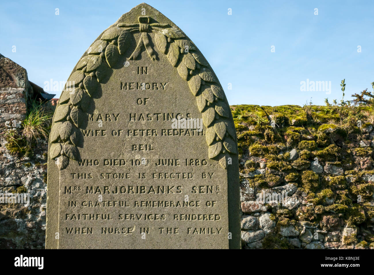 Close up of gravestone in memory of a faithful family nurse in Stenton village graveyard, East Lothian, Scotland, UK Stock Photo