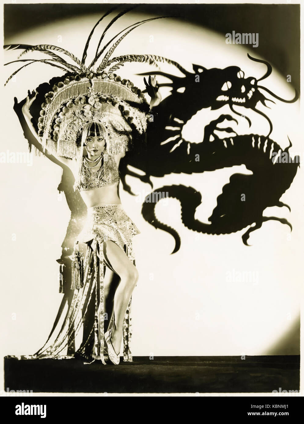 Anna May Wong (1905-1961), the original Dragon Lady (a derogatory stereotypical East Asian sly and deceitful lady); in publicity photograph promoting ‘Daughter of the Dragon’ (1931) in which she played Ling Moy, the daughter of Fu Manchu. See more information below. Stock Photo