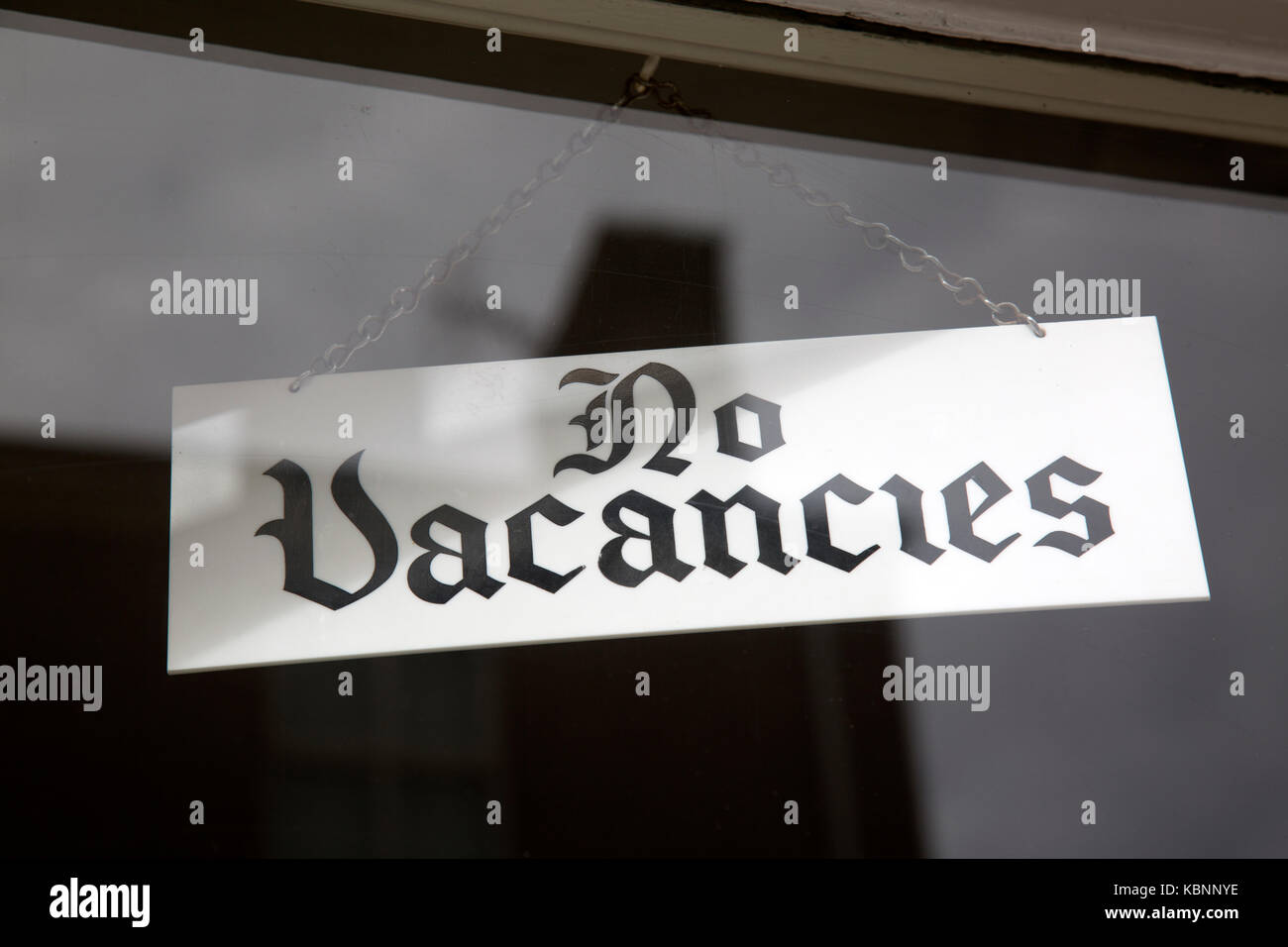 No Vacancies Sign in Hotel Window Stock Photo