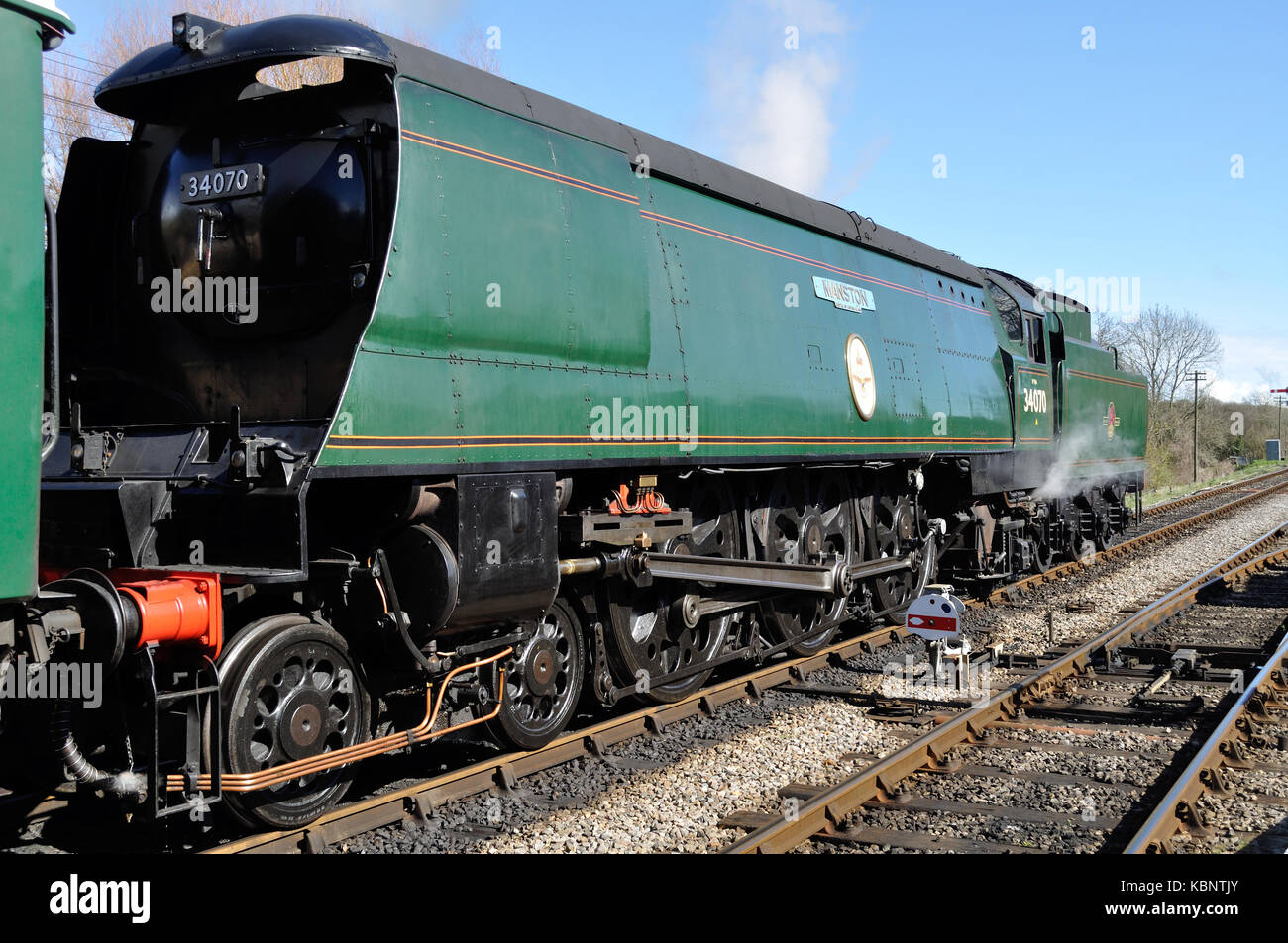Battle of Britain Pacific no. 34070 Manston leaves Corfe Castle station on the Swanage Railway in Dorset Stock Photo