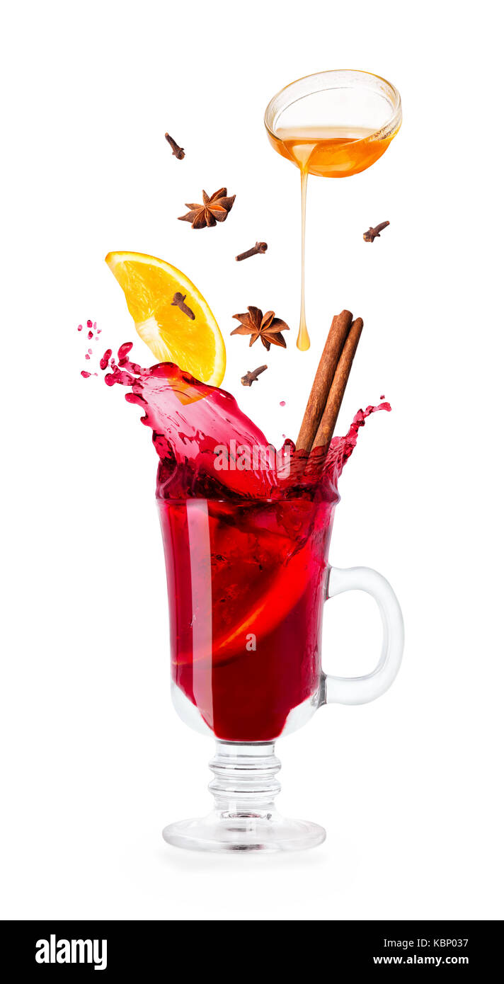 mulled wine with splash and flying ingredients Stock Photo