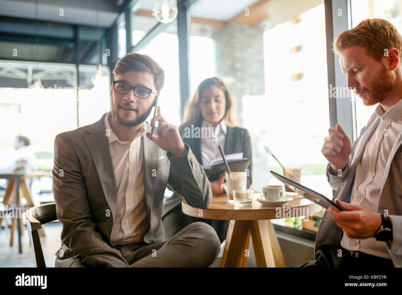 Business people talking and laughing together Stock Photo - Alamy