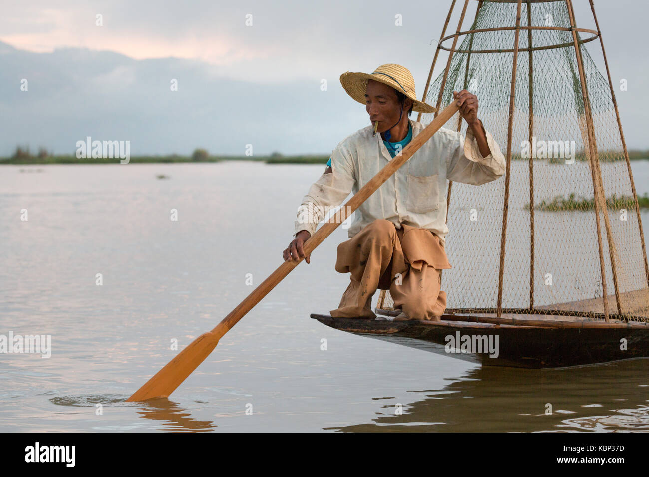 Asia, Myanmar, Inle Lake, Traditional fishermen on lake. Model released. Stock Photo