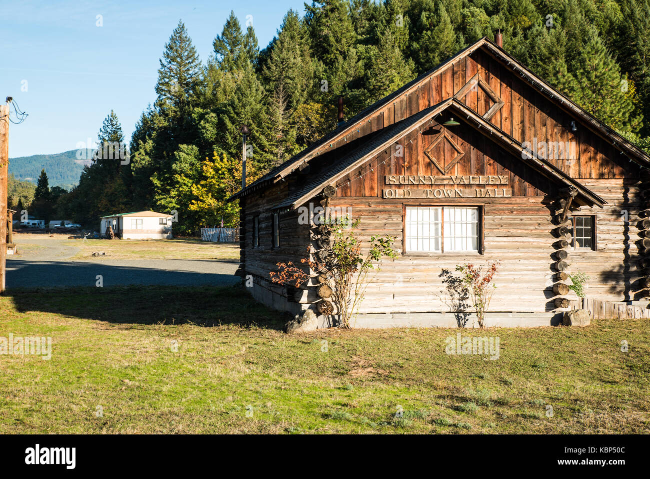 Sunny Valley Old Town Hall-An aging log building in Sunny Valley, Oregon, is the site of a town hall from years past. Stock Photo