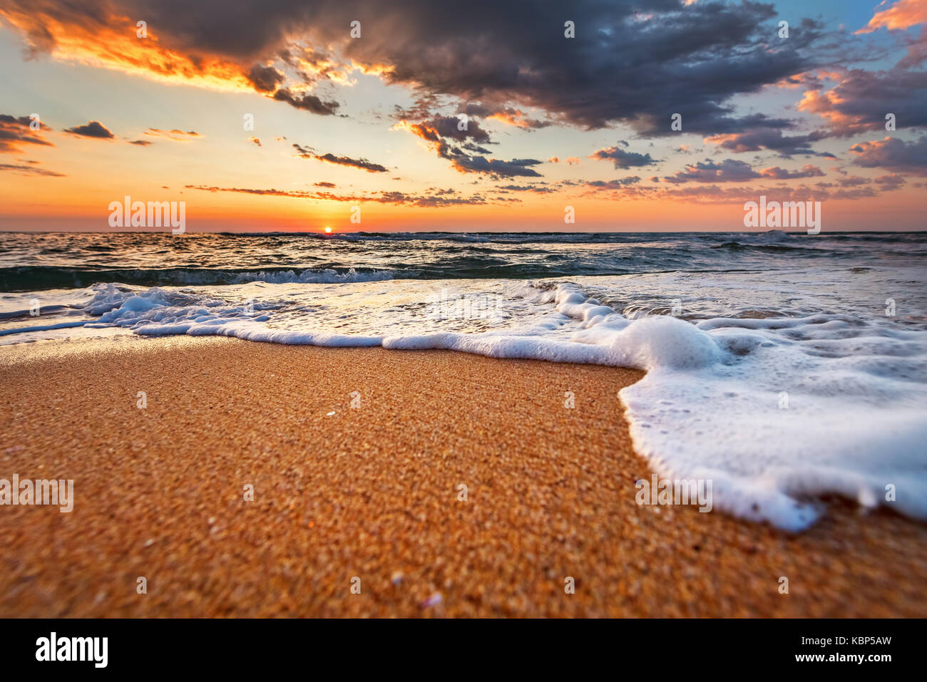Beautiful sunrise over the tropical beach Stock Photo - Alamy