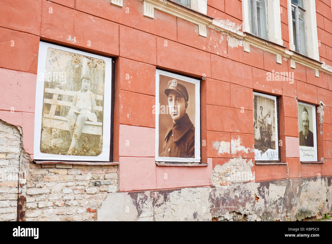 Vilnius, Lithuania - September 15, 2015: Photos discovered on the ruins of Vilnius jewish ghetto displayed in windows of a former ghetto House of cult Stock Photo