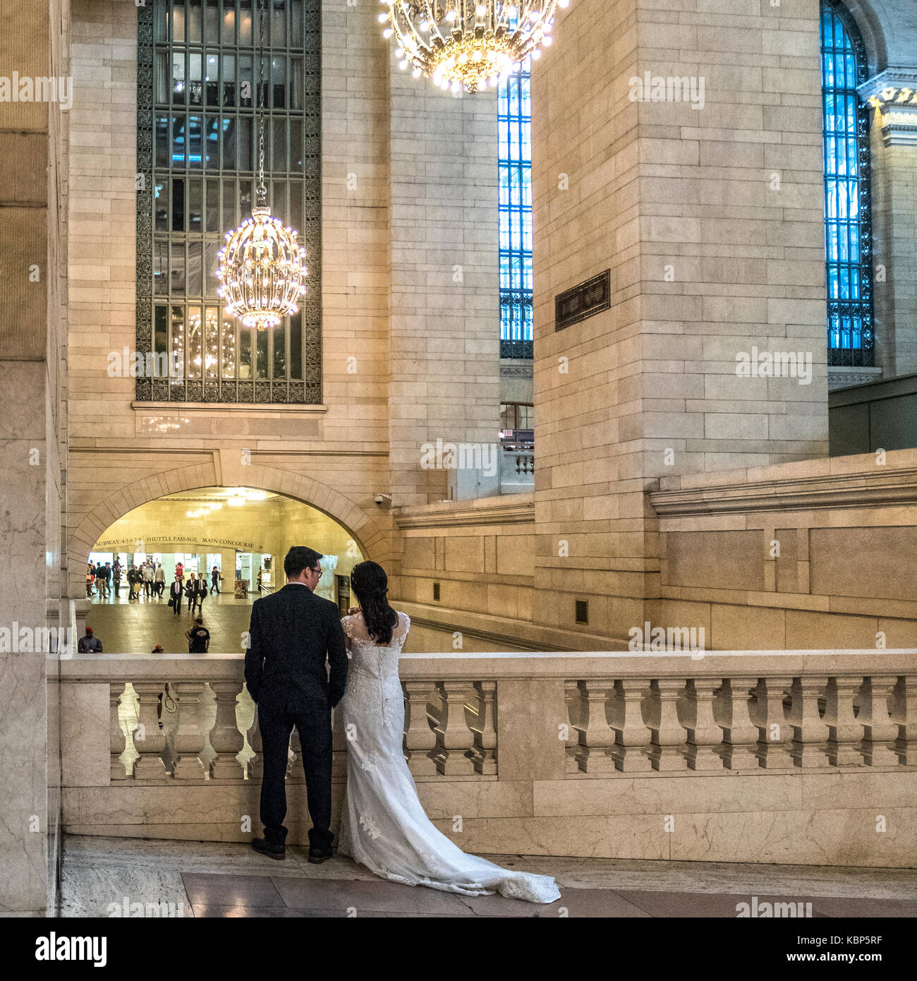 New York, USA, 29 September, 2017. Newlyweds watch passers-by in New York's Grand Central Station. Photo by Enrique Shore Stock Photo