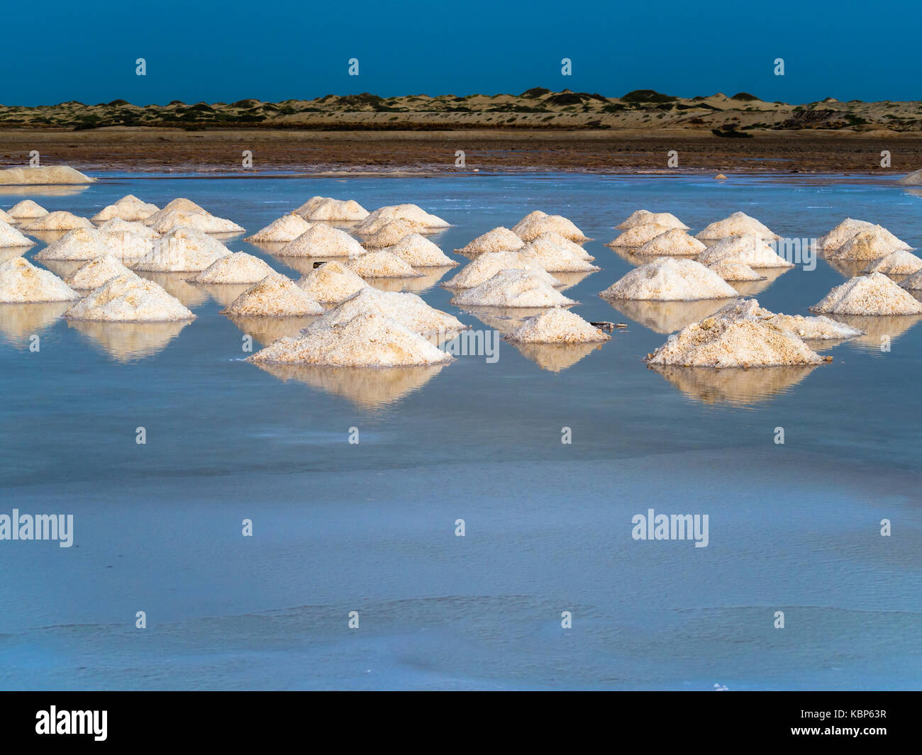 Evaporation pools with fresh salt crystals in Cape Verde, Sal Island Stock Photo