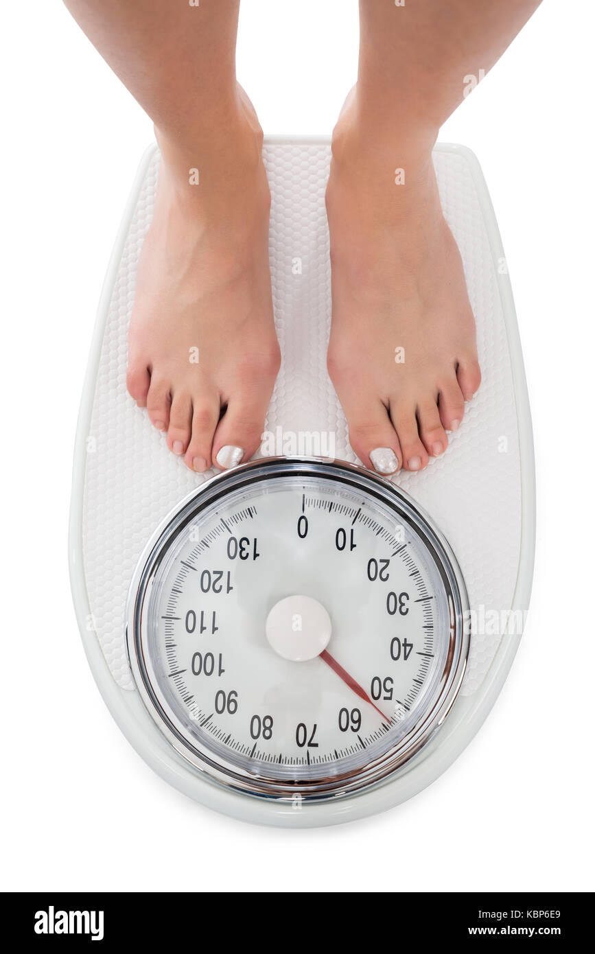 https://c8.alamy.com/comp/KBP6E9/directly-above-shot-of-woman-standing-on-weight-scale-over-white-background-KBP6E9.jpg