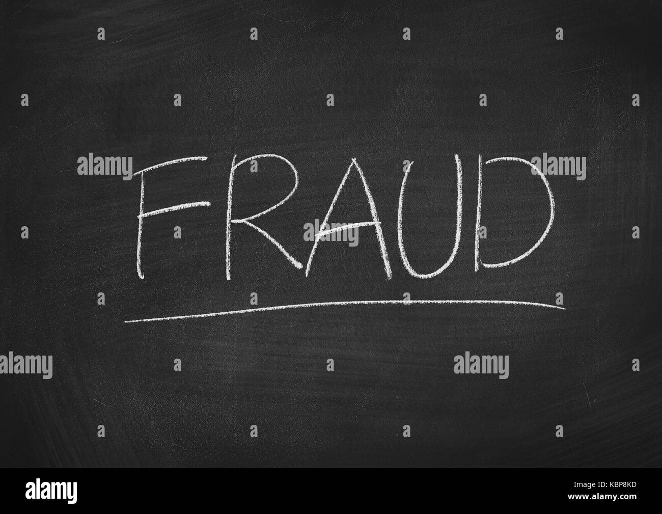 fraud concept word on a blackboard background Stock Photo