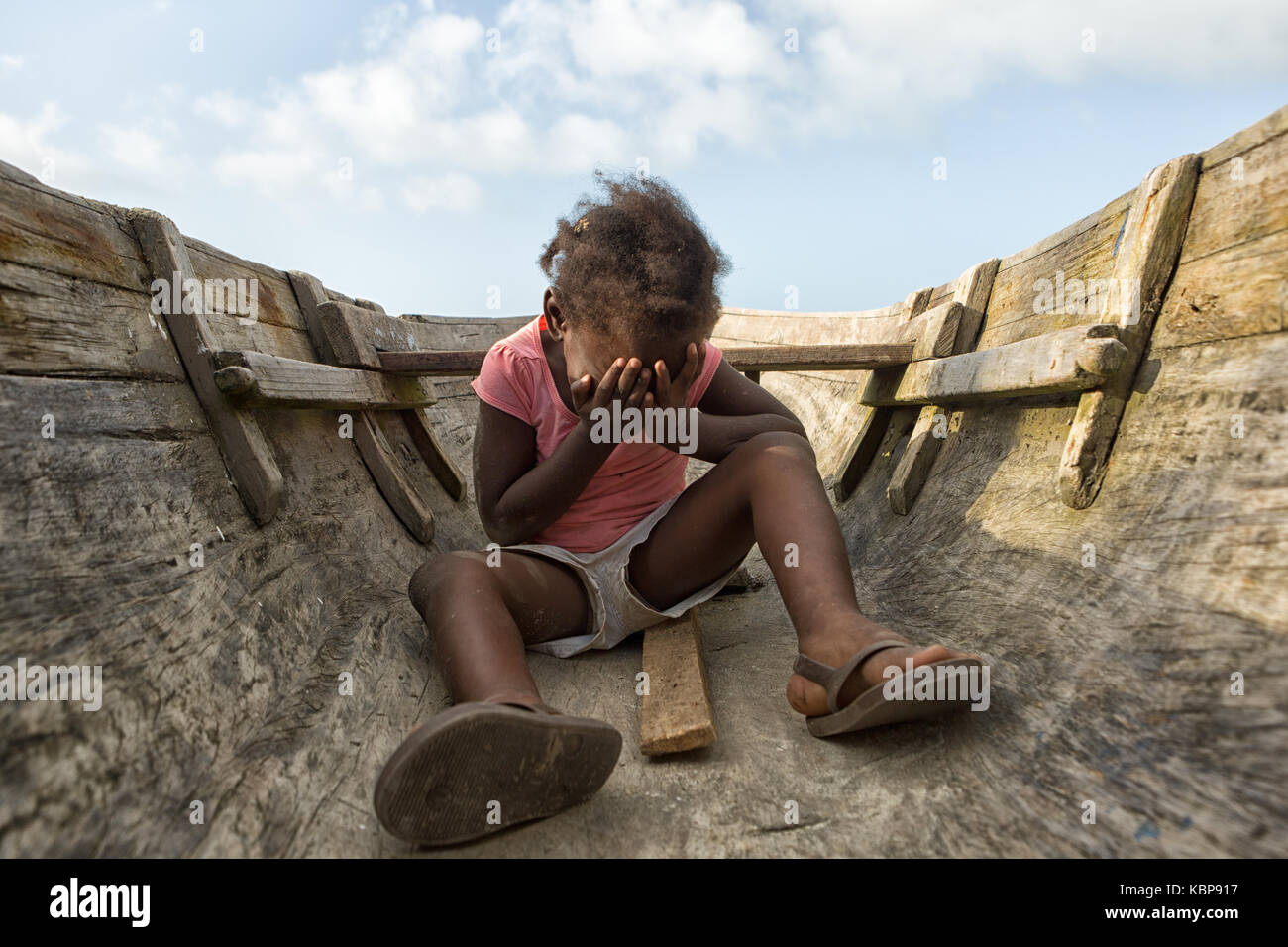 March 11, 2015 Sambo Creek, Honduras: a young garifuna girl sitting on