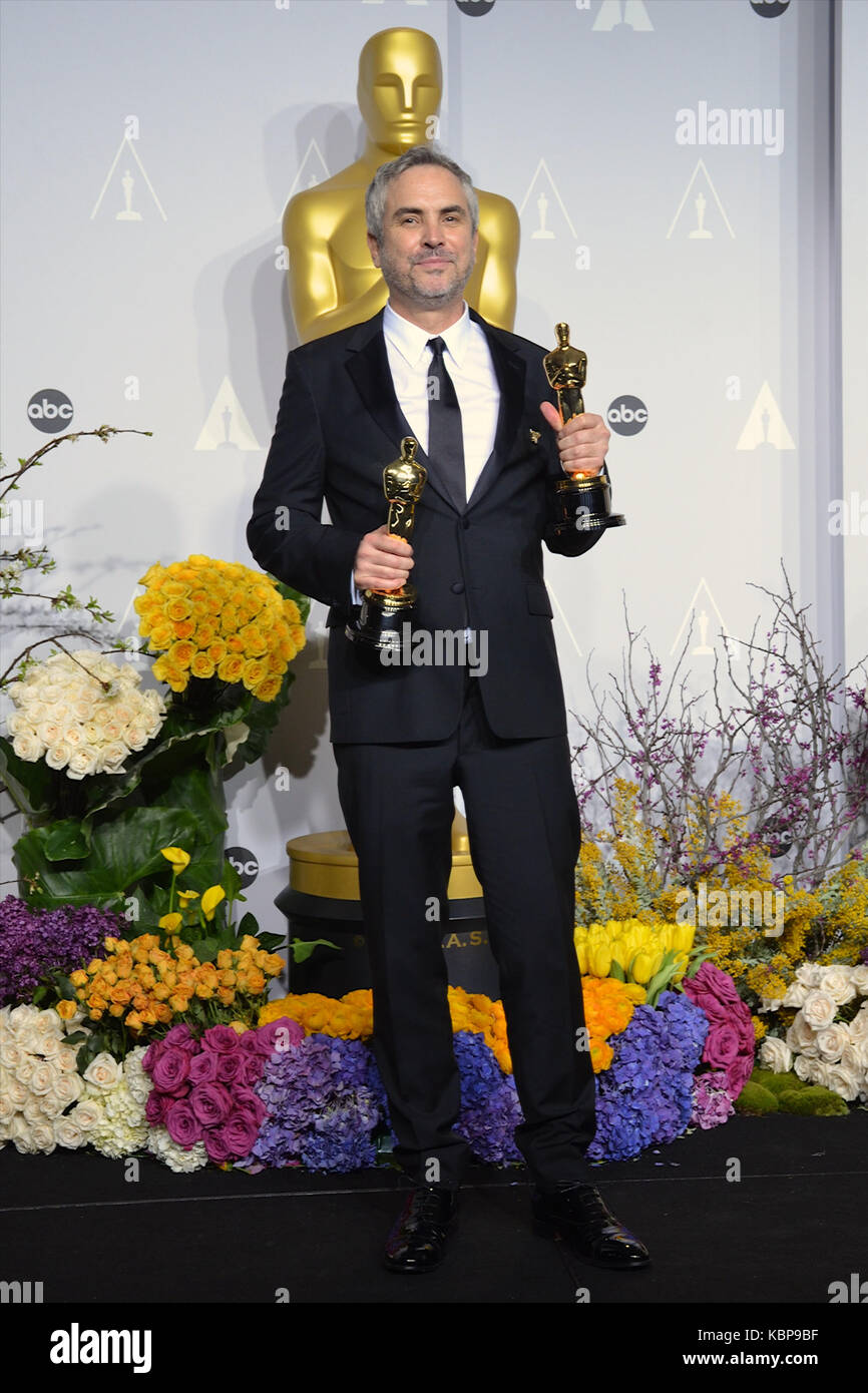 Filmmaker Alfonso Cuaron poses in the press room during the 86th Annual ...