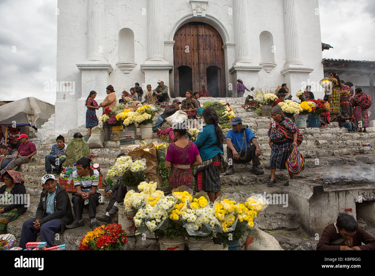 February 5, 2015 Chichicastenango, Guatemala: vendors selling cut flowers on the stairs of the church Stock Photo