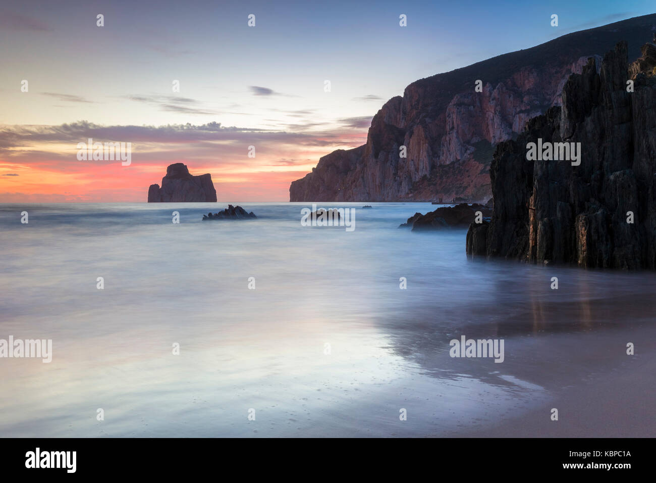 The sunset is reflected on the Beach of Masua, Iglesias