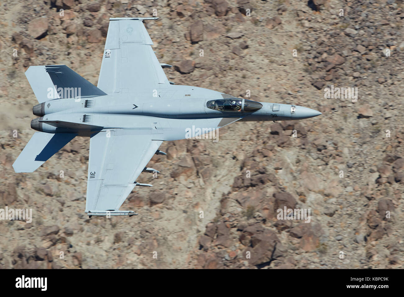 US Navy F/A-18E, Super Hornet, Flying At Low Level Through Rainbow Canyon, California. Stock Photo