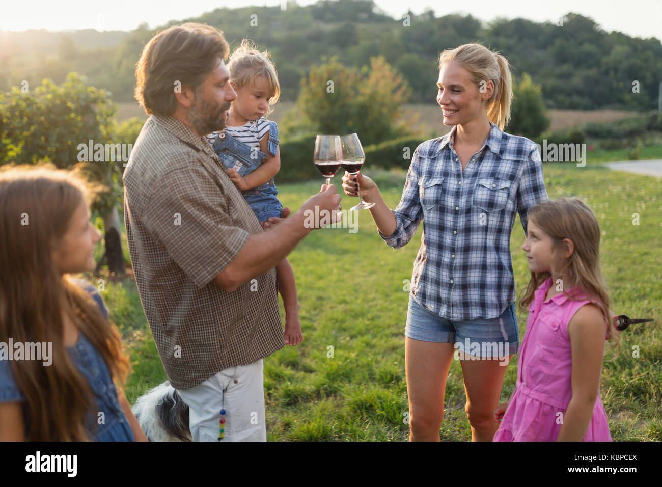 Wine grower family in vineyard before harvesting Stock Photo