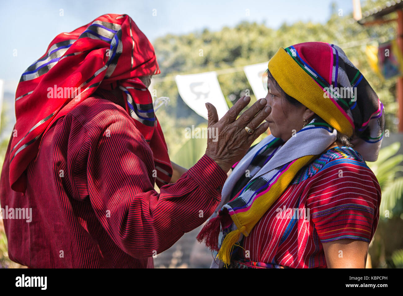 January 31, 2015 San Pedro la Laguna, Guatemala: tata Pedro Cruz one of the last authentic elderly Mayan shamans performing ritual witha woman Stock Photo