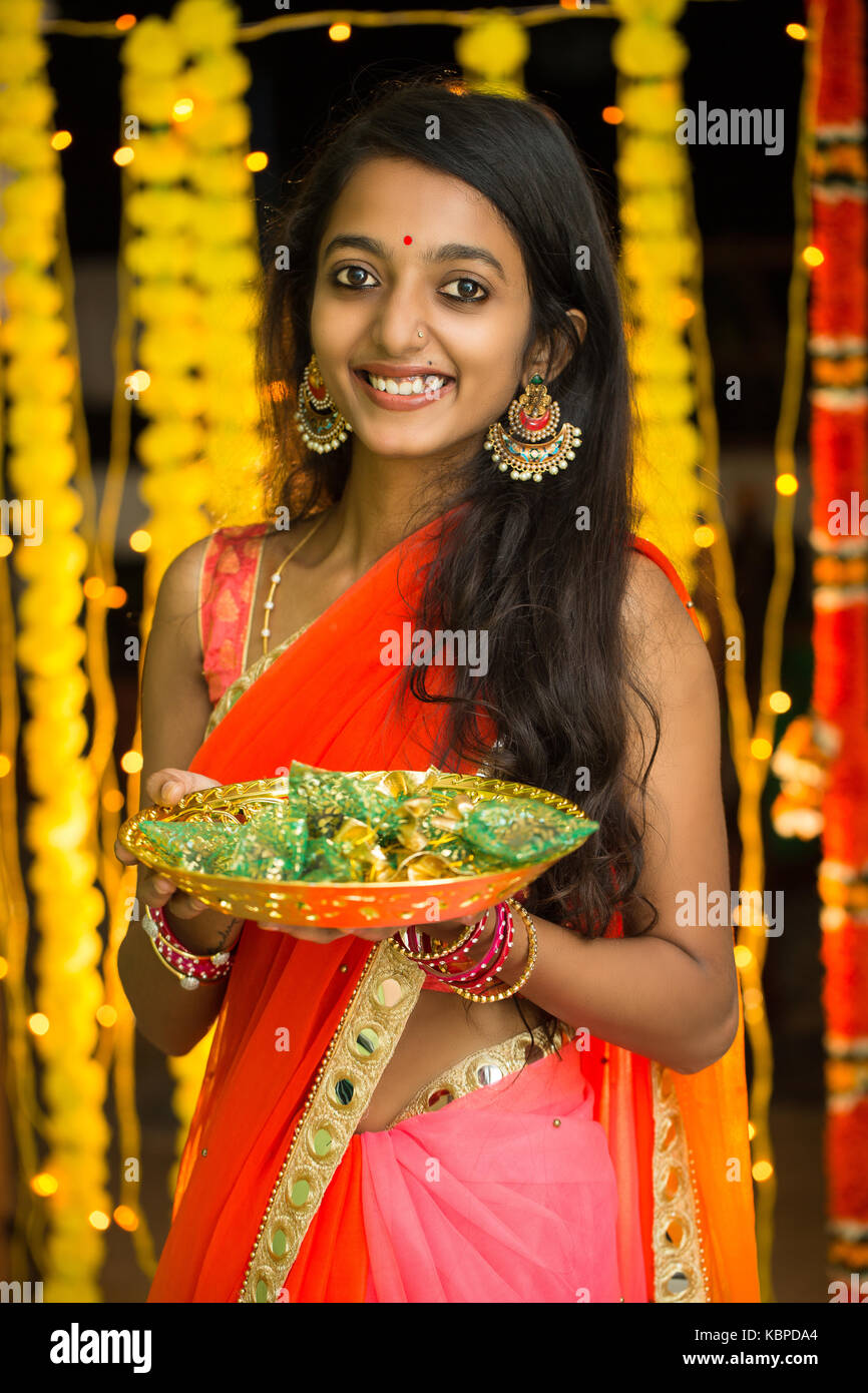 Indian woman smiling, celebration mood, indoor lighting Stock Photo