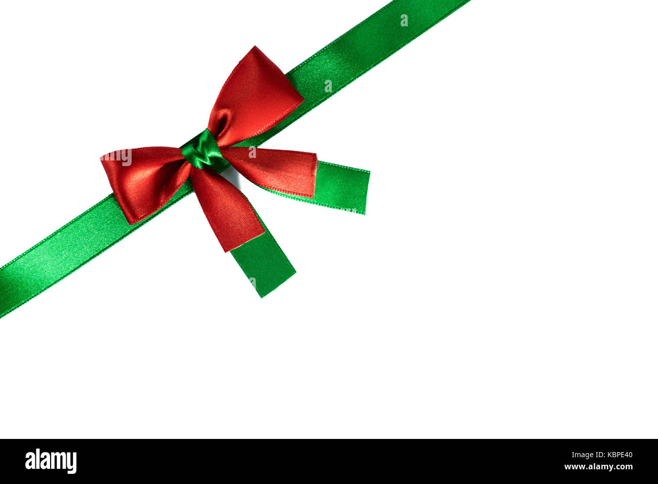 Red and green christmas ribbon bow isolated on white background Stock