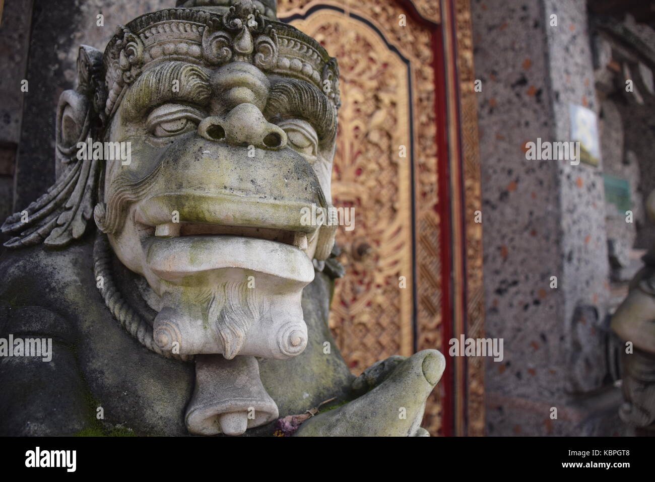 Statue and decorated door on the streets of Ubud, Bali - Indonesia Stock Photo