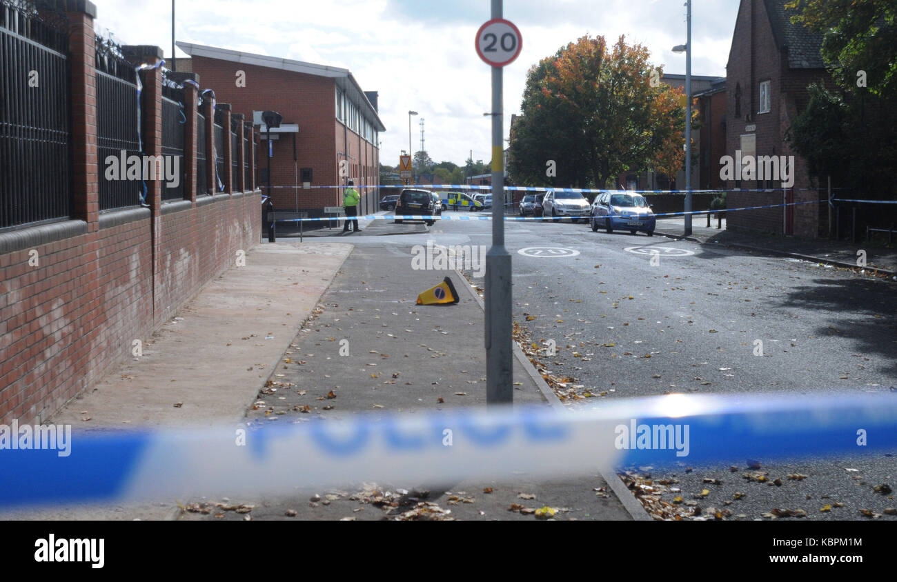 Police at the scene on Herbert Road, Small Heath, Birmingham, as a 14