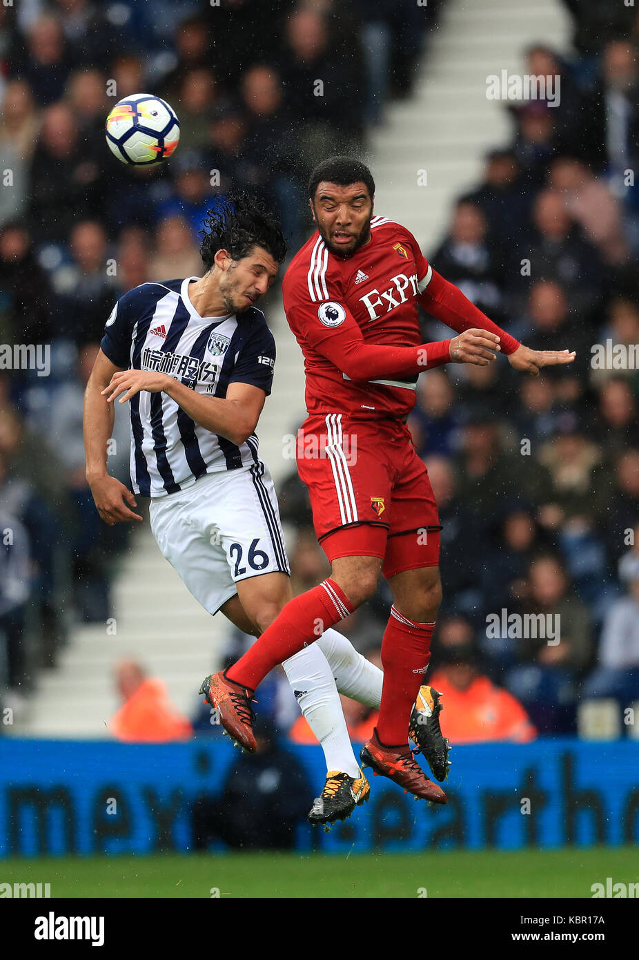 West Bromwich Albion's Ahmed Hegazy and Watford's Troy Deeney battle for the ball during the Premier League match at The Hawthorns, West Bromwich. Stock Photo