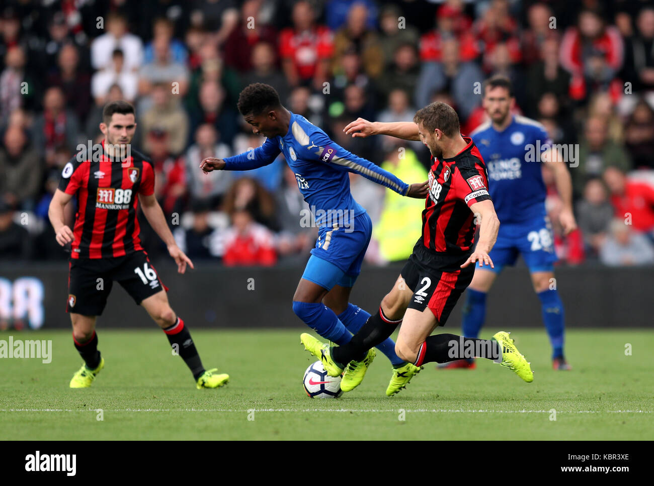 Leicester City's Demarai Gray (left) and AFC Bournemouth's Simon Francis battle for the ball during the Premier League match at the Vitality Stadium, Bournemouth. Stock Photo