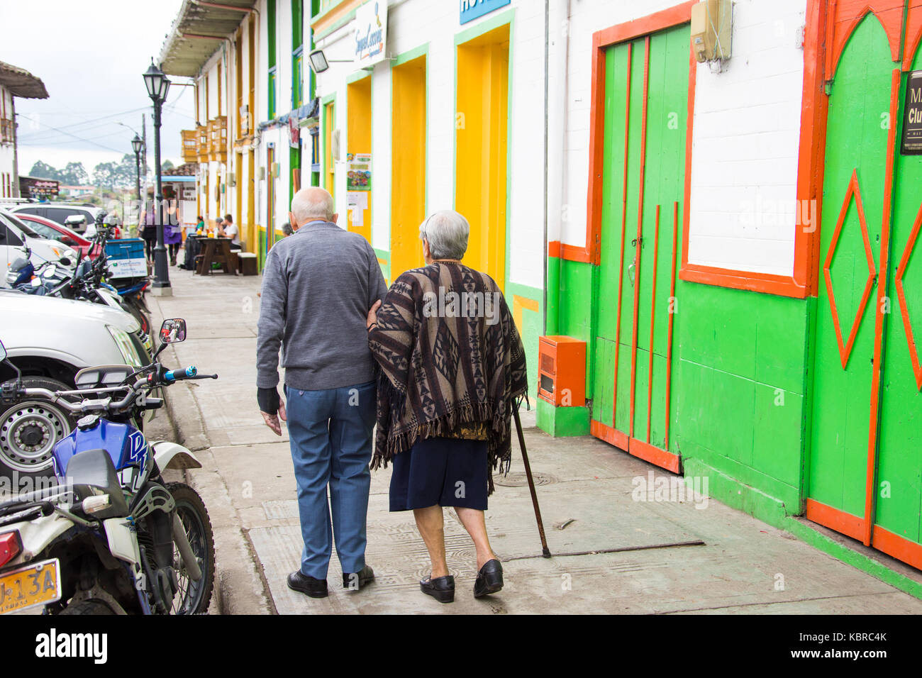 Elderly woman helping her husband walk in Solento, Colombia Stock Photo