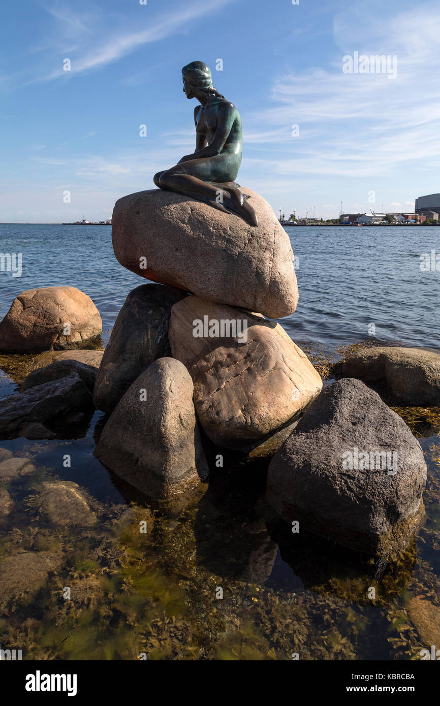 The Little Mermaid at Langelinie promenade in Copenhagen, Denmark. Based on the fairy tale by Hans Christian Andersen, the small and unimposing bronze Stock Photo