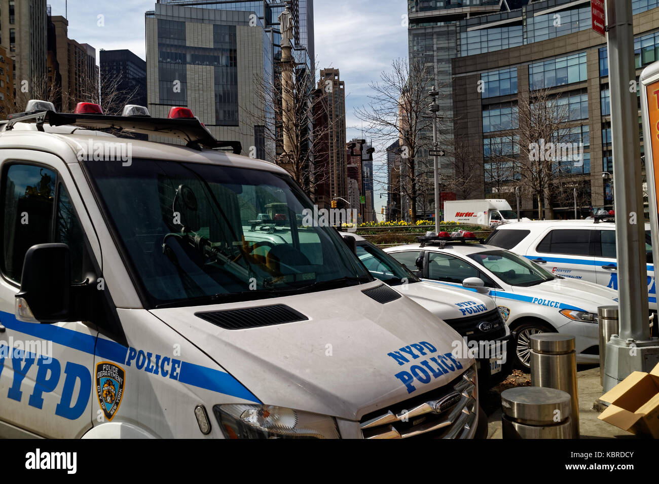 Police cars and trucks parked by Columbus Circle in midtown Manhattan. Stock Photo