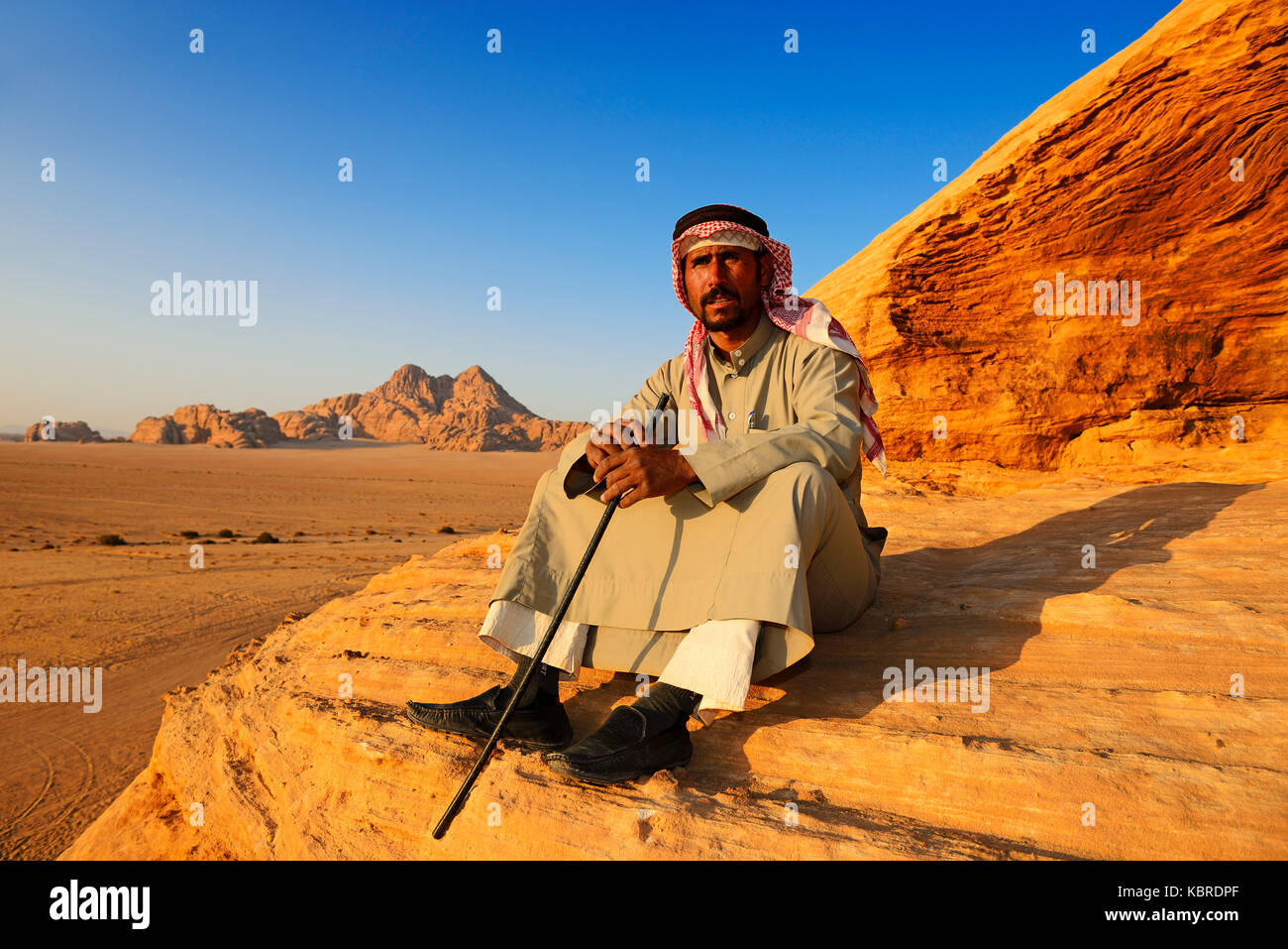 Bedouin looking at Wadi Rum, Jordan Stock Photo