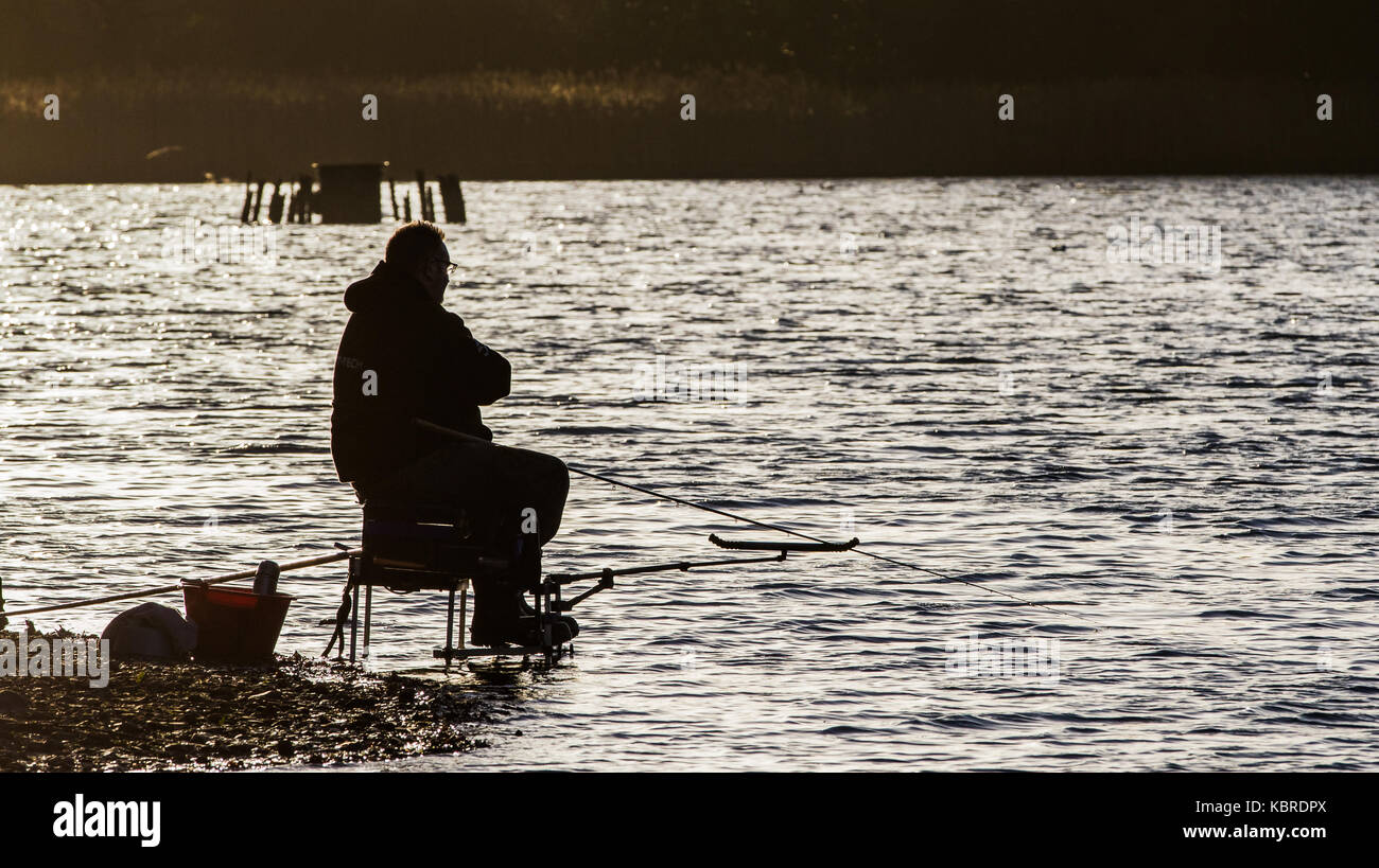 Angler on Chard reservoir, Somerset, UK Stock Photo