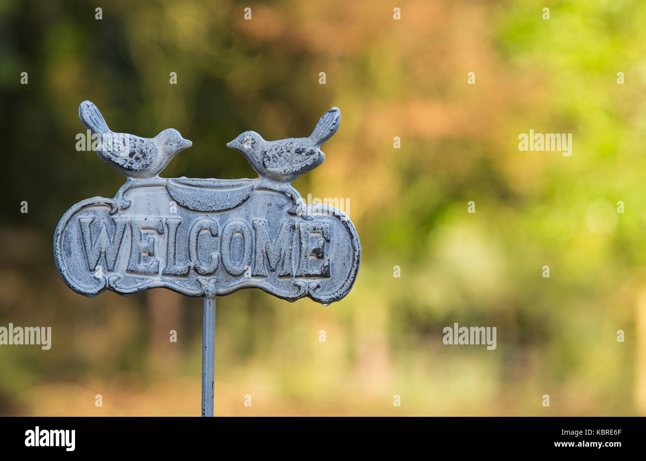 welcome sign with birds Stock Photo