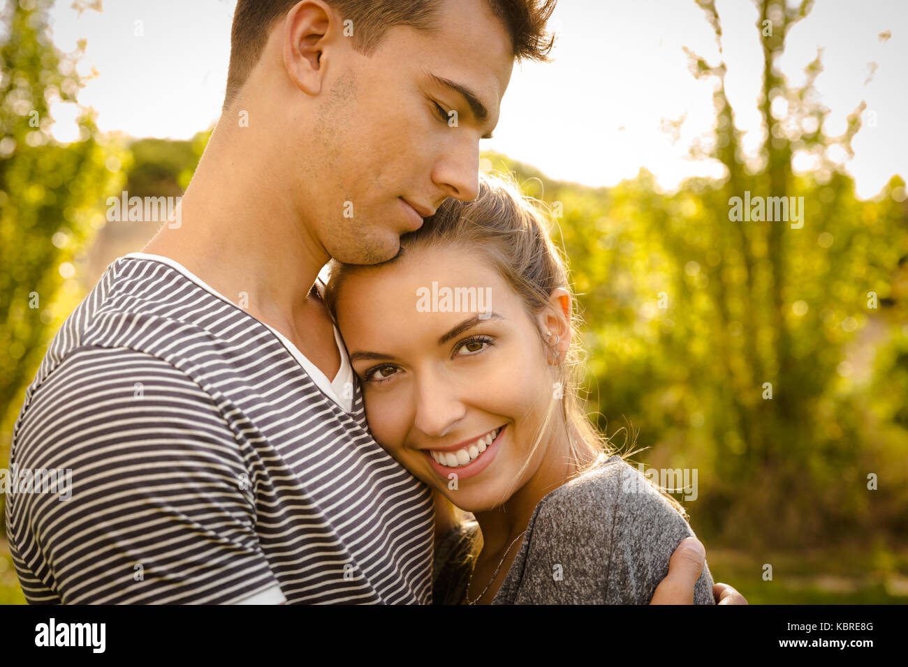 Portrait of a happy young couple in love Stock Photo - Alamy
