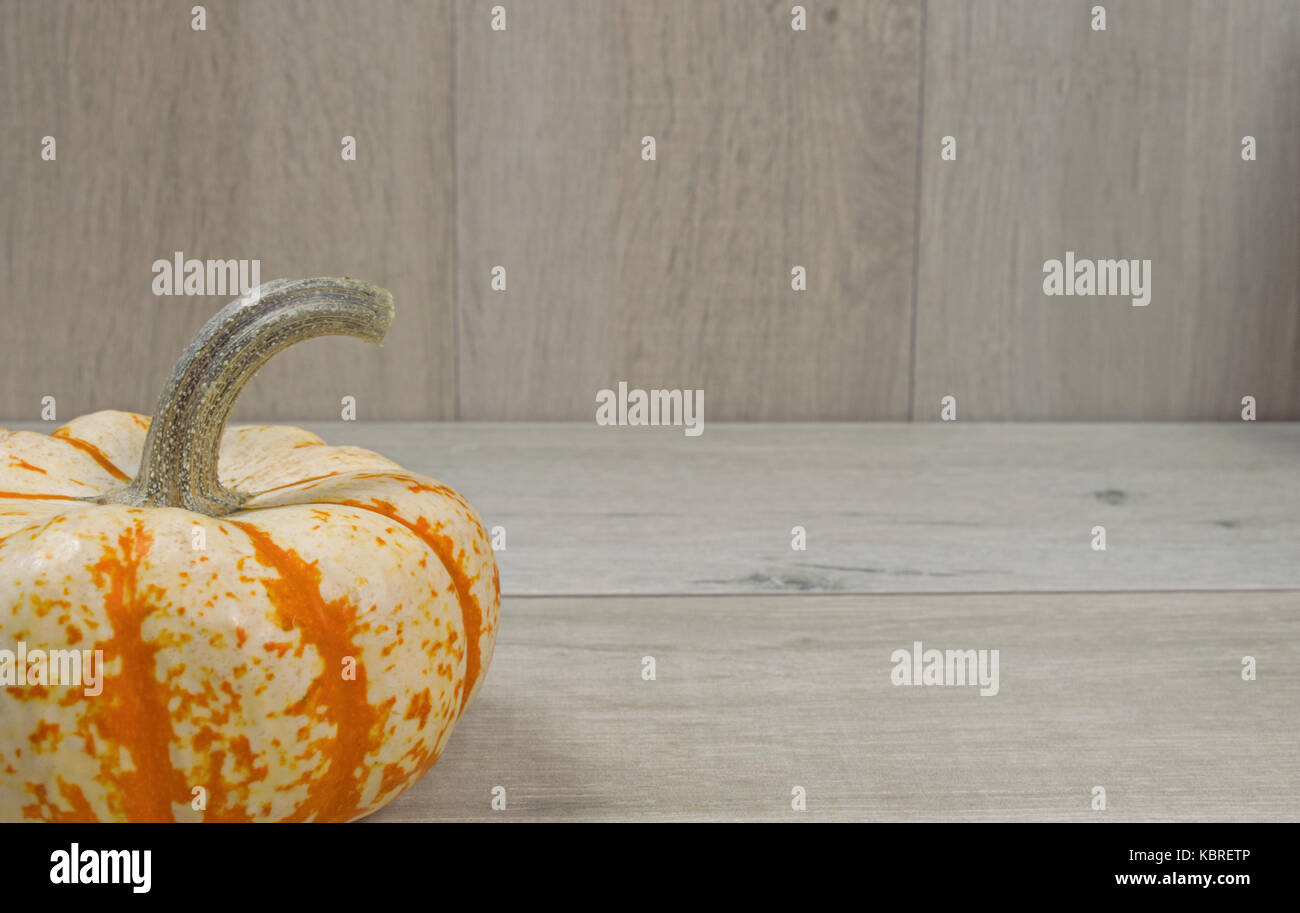 Decorative pumpkin on a wood background Stock Photo - Alamy