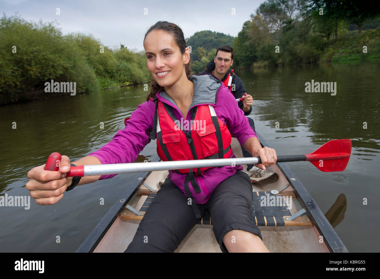 Broadcaster, model, anthropologist Mary-Ann Ochota canoing with her husband Joe Craig on the River Severn with their dog 'Harpo'. Stock Photo