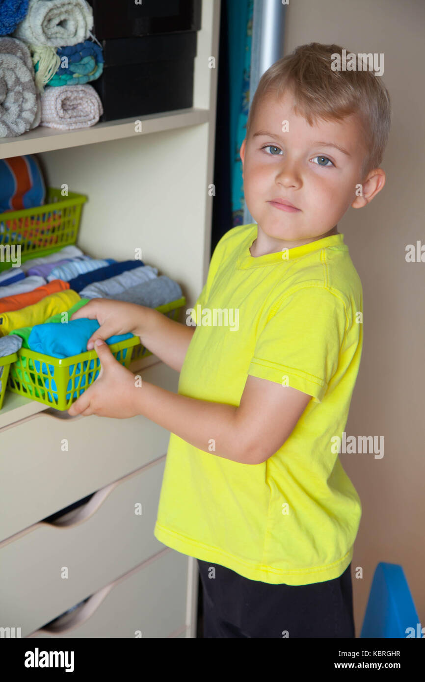 Child pulls on his pants hires stock photography and images Alamy