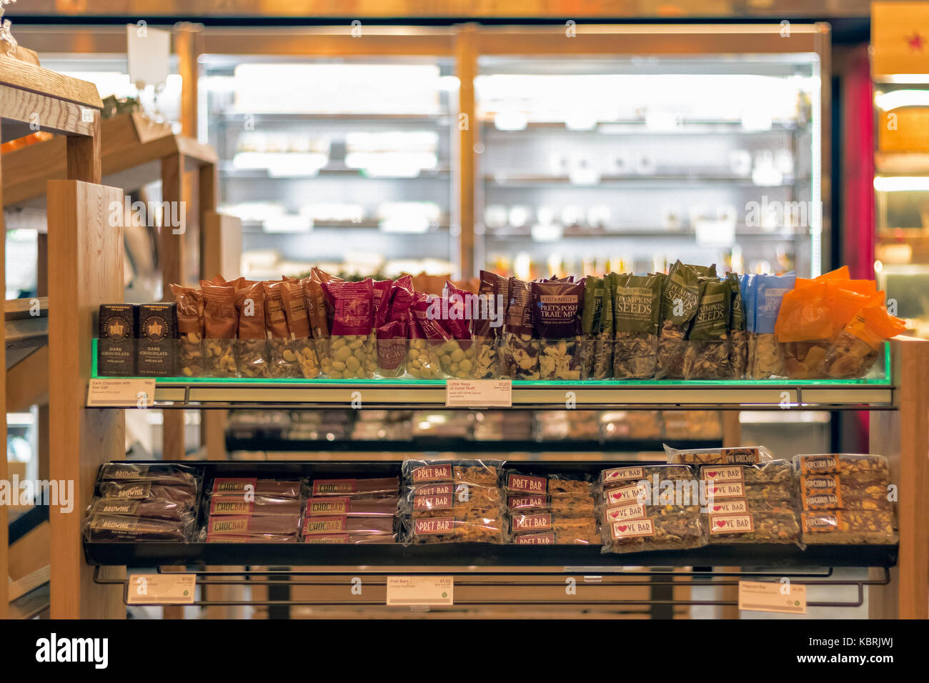 London, UK - September 30, 2017 - Nuts and energy bars displayed on shelves in Pret A Manger, an UK coffee and sandwich shop Stock Photo