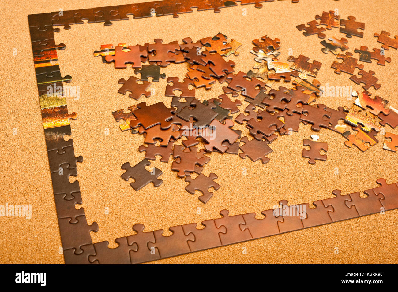 jigsaw puzzle at the start phase with the frame made Stock Photo - Alamy