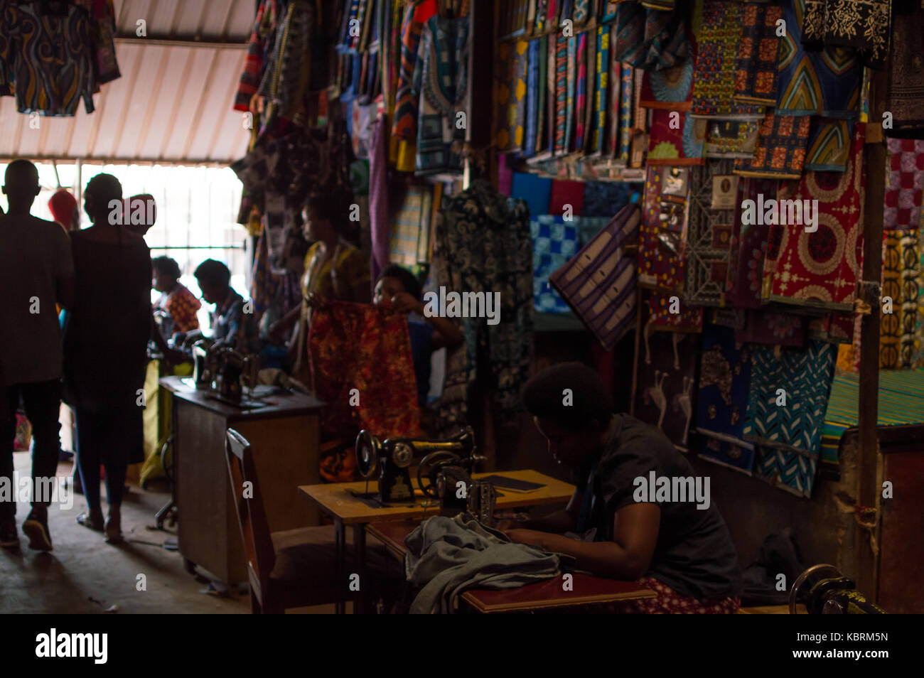 Women Sewing Colorful Clothes at Kimironko Market in Kigali, Rwanda Stock Photo