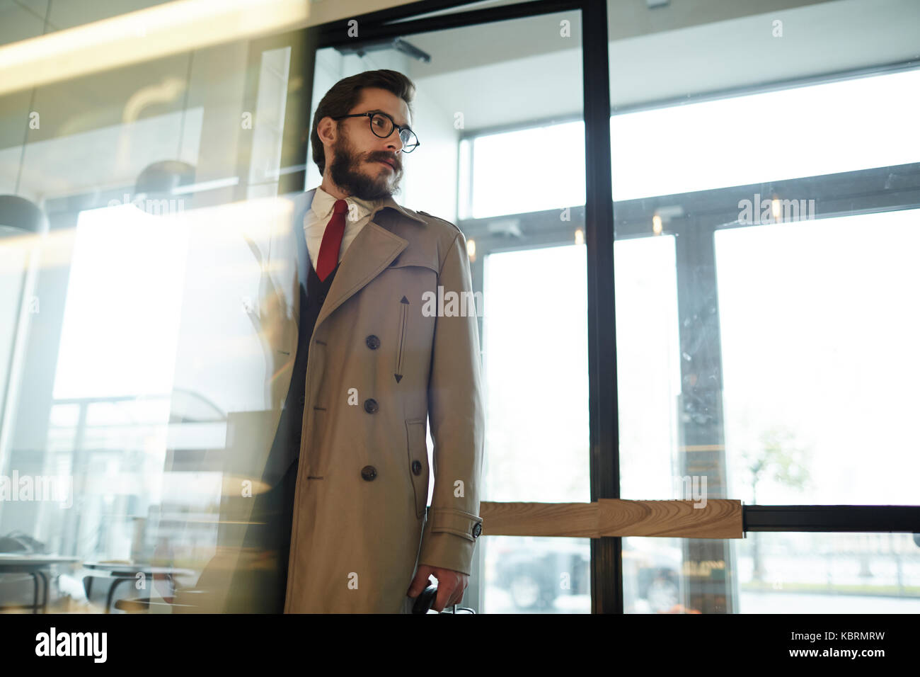 Businessman in trenchcoat Stock Photo