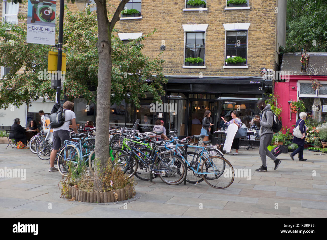 Local people walking past Herne Hill rail station in London,UK Stock Photo