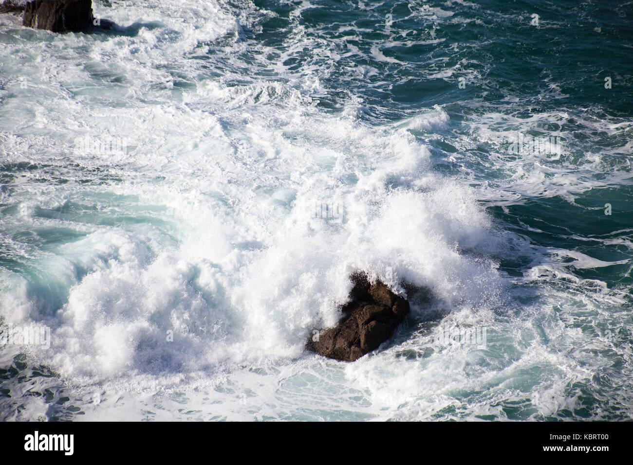 Breaking waves off the Cornish coast. Stock Photo